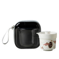 White porcelain guppy travel tea set with lidded brewer, cup and black zip case