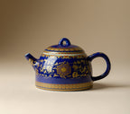 Cobalt-blue Qingding Gold Floral Teapot on a neutral background