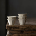 Wood Ash Eight-Facet Tasting Cups arranged in a stack