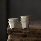 Wood Ash Eight-Facet Tasting Cups arranged in a stack