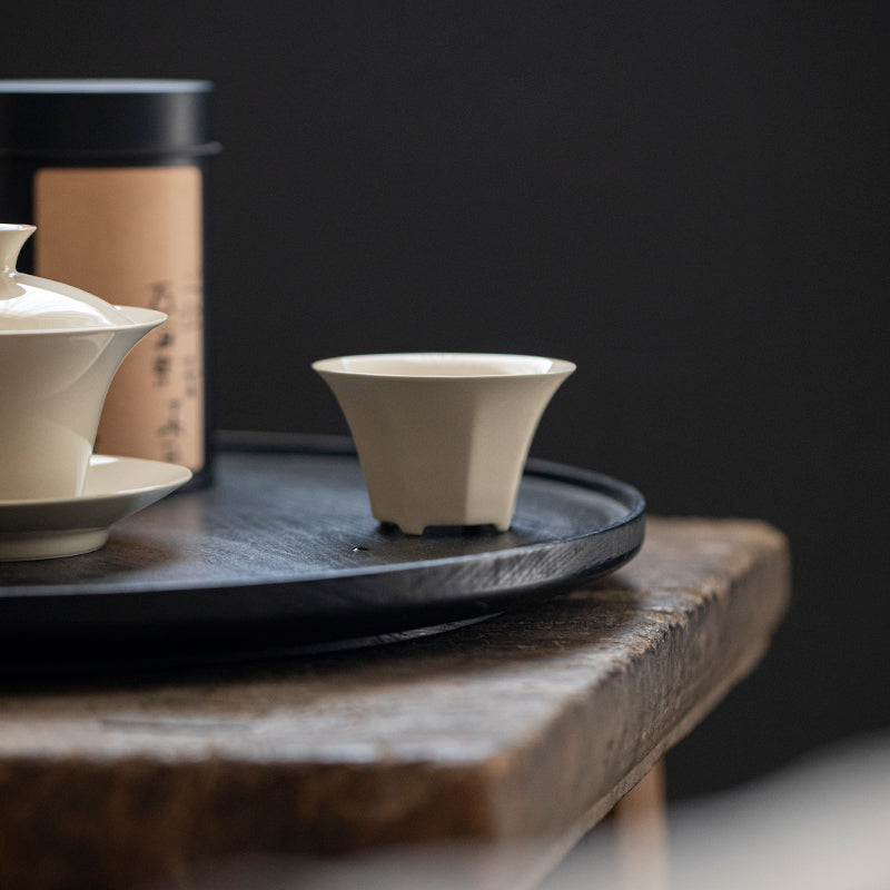 Wood Ash Eight-Facet Tasting Cup held in hand