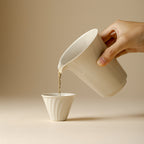 Wood Ash Horseshoe Fairness Pitcher pouring tea