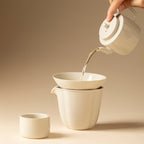 Tea poured through the Wood Ash Jinzhao Tea Strainer