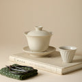 Wood Ash Nafu Gaiwan with saucer on a quiet tea table